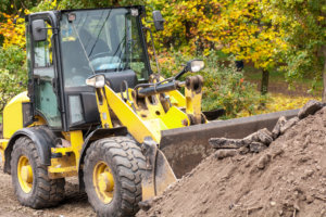 wheel loader clears the road during construction work